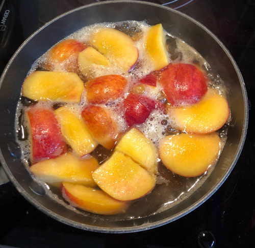 peaches in pan starting to boil